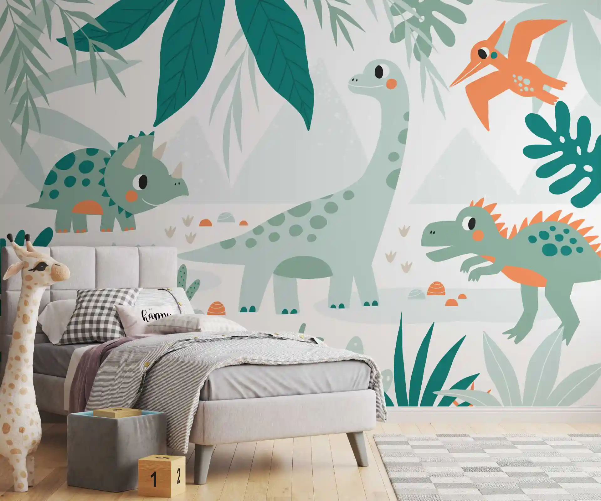 Tapete Dinosaurier in Mint und Orange hinter einem grauen Polsterbett mit Plüschgiraffe